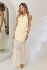 Sandy lemon knit waistcoat & pleated sheer maxi skirt
