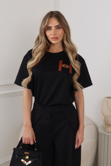 MIA BLACK T-SHIRT WITH FAUX LEATHER H BUCKLE
