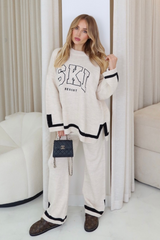 Ski resort beige embroidered knitted jumper and trousers