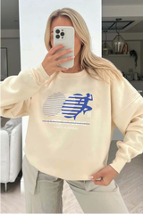 Running blue printed ecru sweater