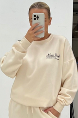 New York black embroidered ecru sweater