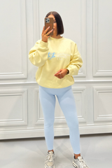 LOS ANGELES RUNNING CLUB BUTTER YELLOW PRINTED SWEATER