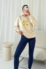 Smiley pattern ecru embroidered sweater and legging set