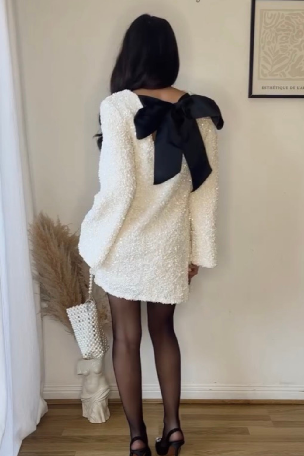 cream dress black tights Giambattista Valli Paris Ready to Wear Autumn Winter Patterned cream dress cropped sleeves, black tights and black ankle boots Stock Photo