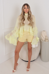 Florentina lemon sheer flared sleeve ruffle hem blouse