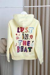 Lost in the beat butter printed premium hoodie