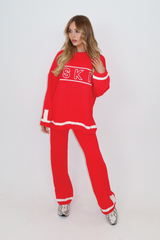 Ski embroidered red knitted jumper and trousers