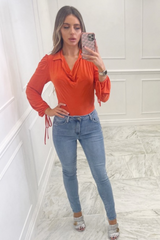 Aria orange cowl neck long sleeve bodysuit