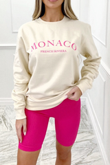 Monaco bright pink embroidered cream sweater