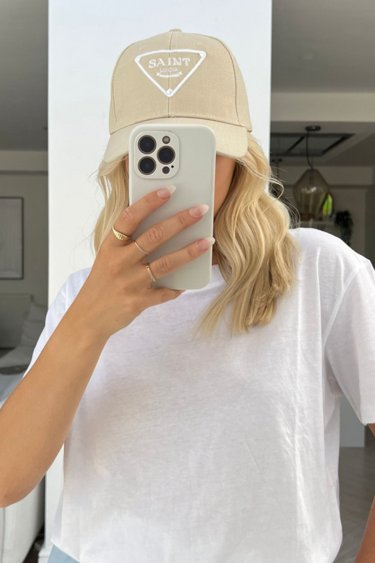 saint lucia stone and white embroidered cap.