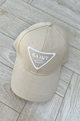 saint lucia stone and white embroidered cap.