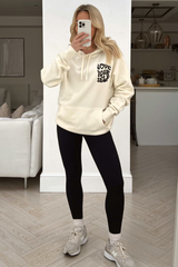 love your self ecru & black printed draw string hoodie