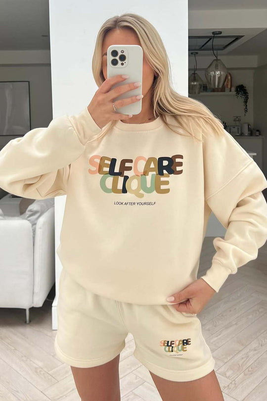 self care clique muted print ecru sweater short loungewear set